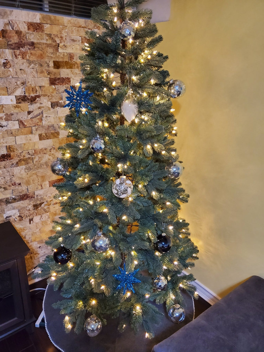 Artificial spruce Christmas tree with metal stand