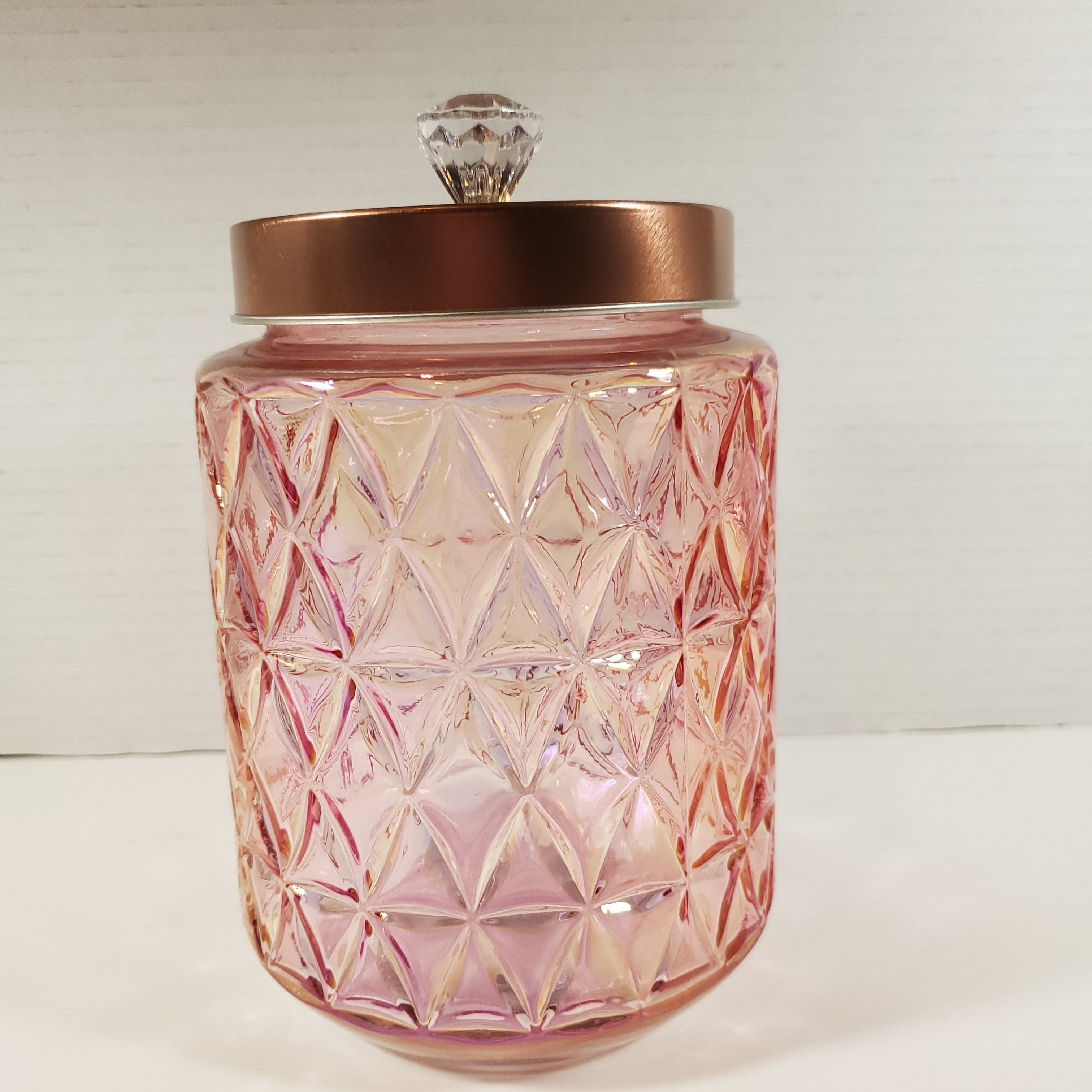 Blush pink textured glass storage jar with gold lid and crystal knob used for candy buffet and event table decor