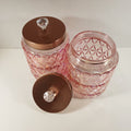 Blush pink textured glass storage jar with gold lid and crystal knob used for candy buffet and event table decor